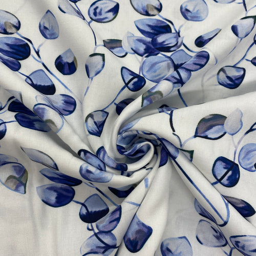 Blue vine leaf on white viscose - 1/2mtr - Dressmaking Fabric