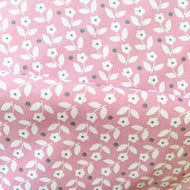 Pretty pink background with white ditsy floral and dot cotton fabric