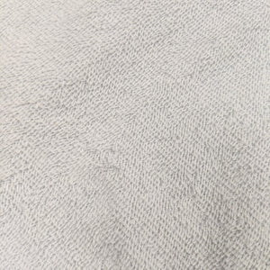 white plastic backed cotton towelling