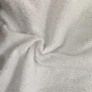 white plastic backed cotton towelling