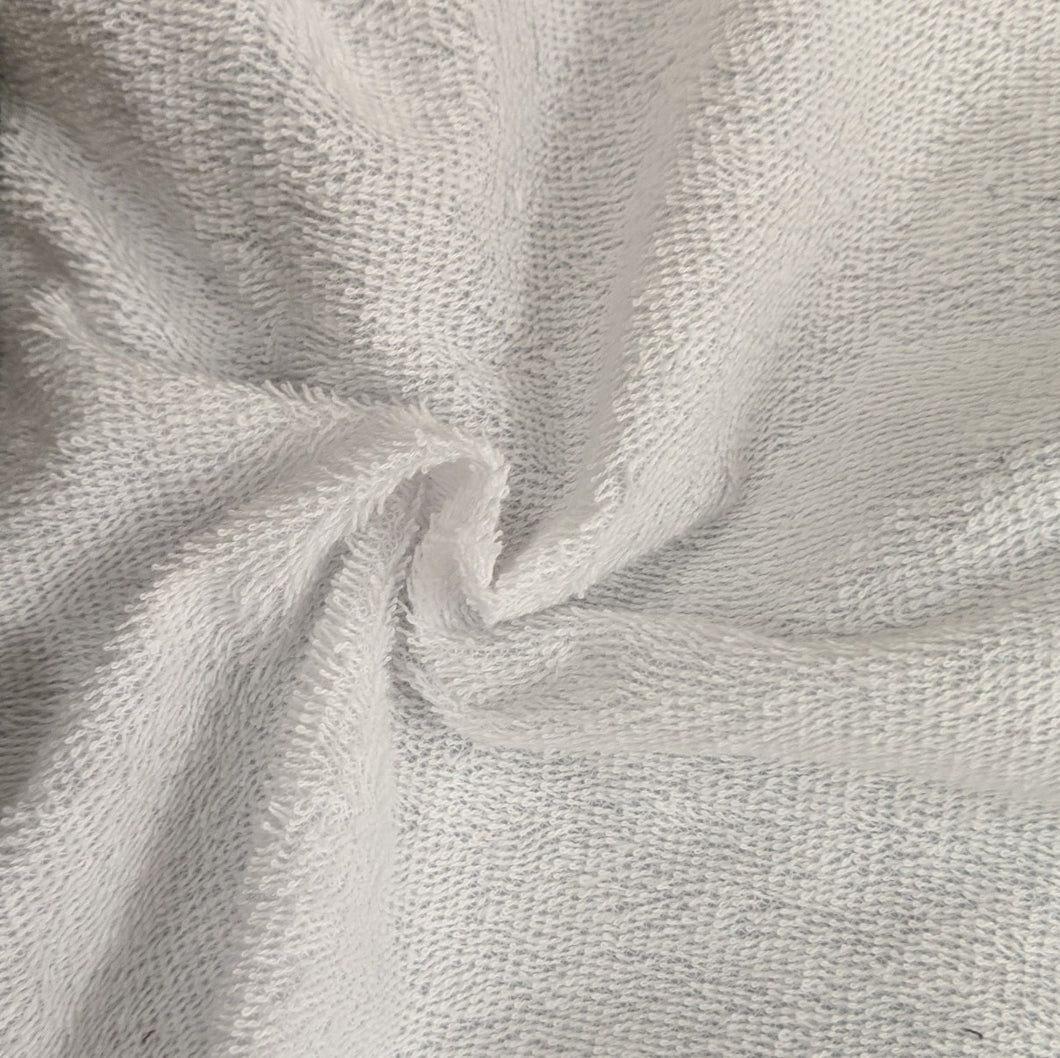 white plastic backed cotton towelling