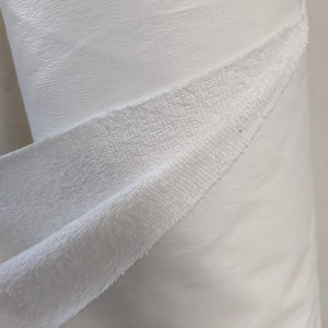 white plastic backed cotton towelling