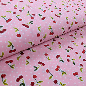 Cherries on pink cotton fabric (wide) - 1/2 mtr