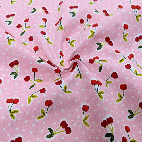 Cherries on pink cotton fabric (wide) - 1/2 mtr