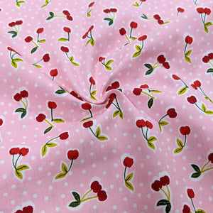 Cherries on pink cotton fabric (wide) - 1/2 mtr