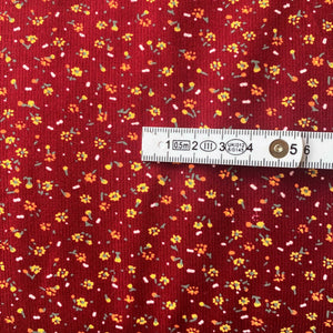 Burgundy red ditsy floral needle cord x 1/2mtr