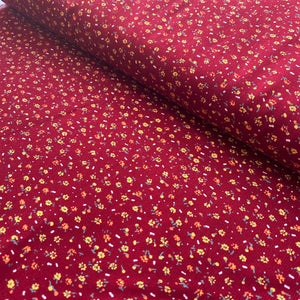 Burgundy red ditsy floral needle cord x 1/2mtr